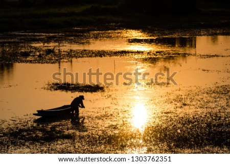 fisherman in the river when the sunset