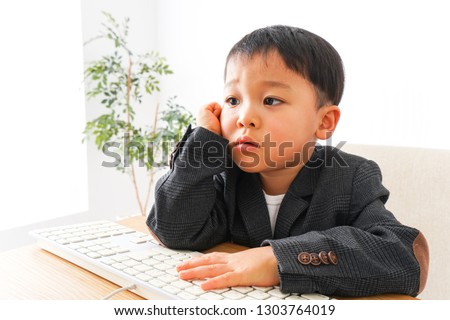 Child businessman at office