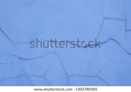 Blue wall surface with cracks, background ideas or wallpaper