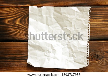 Paper. Crumpled paper on wooden background