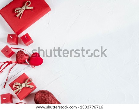 White background with red hearts, gifts and candles. The concept of Valentine Day.  View from above