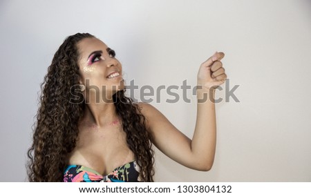 Happy smiling woman gesturing with hands and showing balance