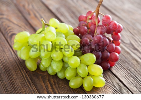 Grapes on a wooden table Royalty-Free Stock Photo #130380677