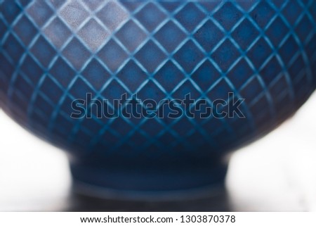 A blue bowl on a kitchen counter. 