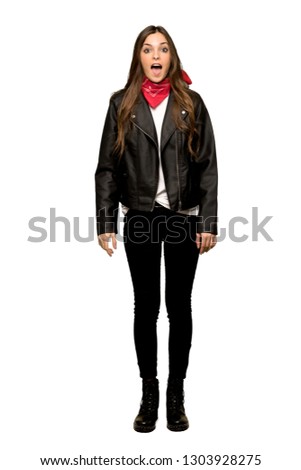 Full-length shot of Young woman with leather jacket shouting to the front with mouth wide open on isolated white background