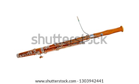 Wooden bassoon isolated on a white background. Music instruments series Royalty-Free Stock Photo #1303942441
