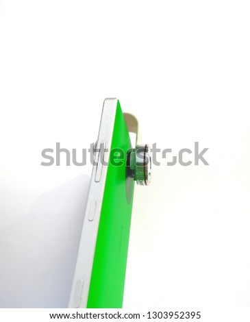Green smart phone with lens isolated on white background