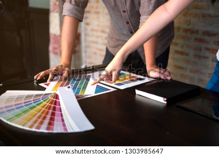 Graphic designers choose colors from the color bands samples for design .Designer graphic creativity work concept . 