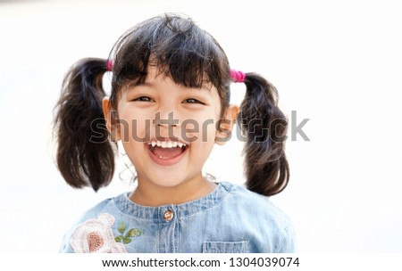 Happy Asian cute kid smiling with happiness. face expression concept. isolated on white background        