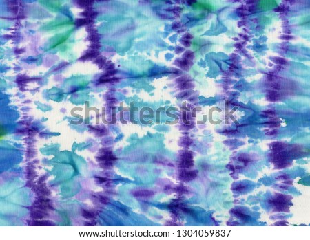 Texture of natural linen fabric. Batik.Textile shibori print. Indigo blue tie-dye textile. Watercolor effect. Royalty-Free Stock Photo #1304059837