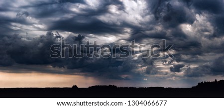 Panoramic image of storm clouds with asperitas clouds