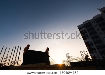 working on the roof of a multi-storey building
