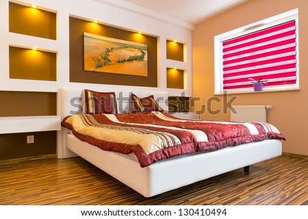 Master bedroom interior with picture of shipwreck on the wall. Photo of shipwreck is available in my gallery.