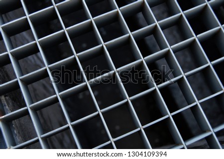 background with metal grid on the floor