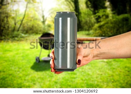 Hand with free space for your beer or drink. Blurreed background . 