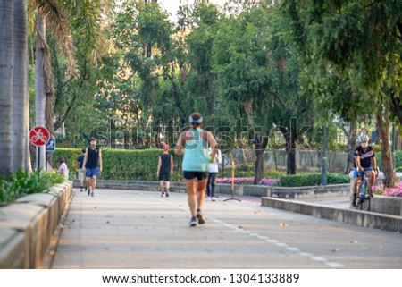 Blurry image people running exercise for health in the Benjakitti Park , Bangkok in Thailand.