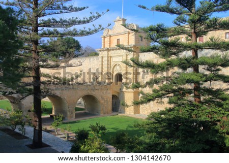 The photo was taken on the island of Malta in the month of January. The picture shows the entrance through the bridge to the ancient city of Mdina.