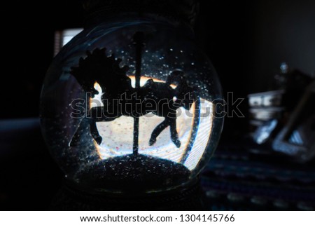 glitter snow globe with horse silhouette 