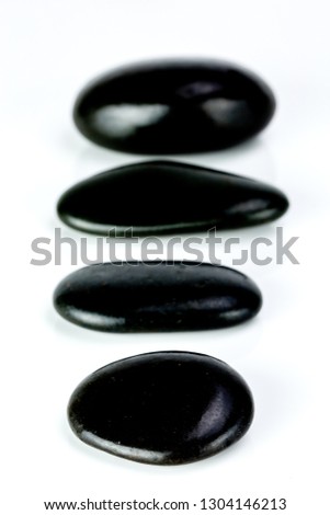 Zen black Stones aligned on a white background