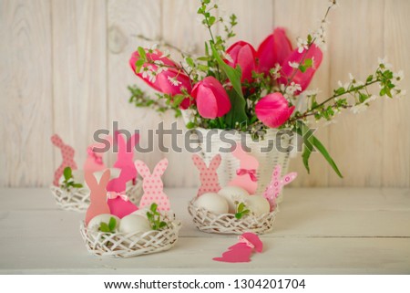 Happy easter. Decor of Easter eggs in small white baskets. Selective focus.