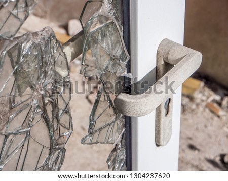 Door after a burglary Royalty-Free Stock Photo #1304237620