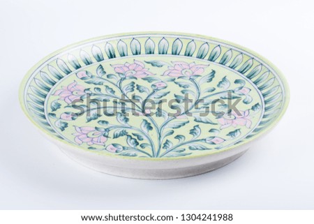 painted ceramic plate on white background
