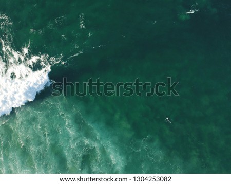 Aerial view from a surfer taking a wave. Drone photo. Surf Spot