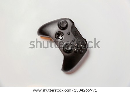 Black joystick gamepad, game console isolated on white background. Computer gaming technology play competition videogame control confrontation concept. Cyberspace symbol