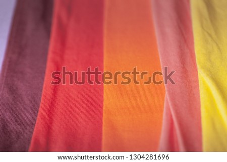 green yellow pink orange and red tee shirts. colorful of 100 percent cotton tee shirts in tee shirt factory
