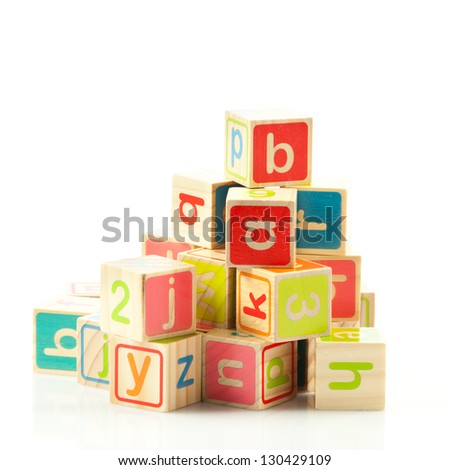 wooden toy cubes with letters. Wooden alphabet blocks. Royalty-Free Stock Photo #130429109