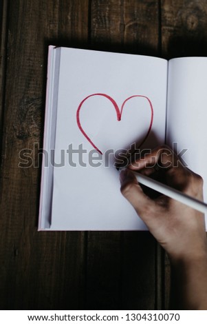 drawing of a heart in a notebook on Valentine's Day