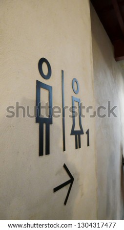 Cement force showing the bathroom symbol with male and female figure