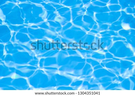 Water in swimming pool blue background