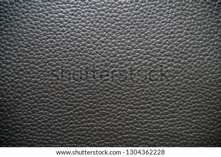 Material of Genuine fullgrain black leather texture crafts background