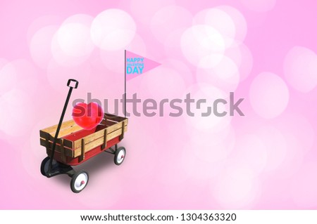 Heart in little red wood wagon with free space for text input, logo, etc. Concept Valentine DAY , I love you . 