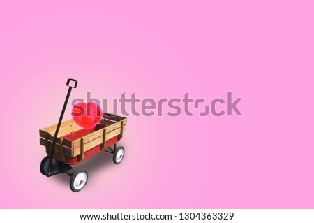 Heart in little red wood wagon with free space for text input, logo, etc. Concept Valentine DAY , I love you . 