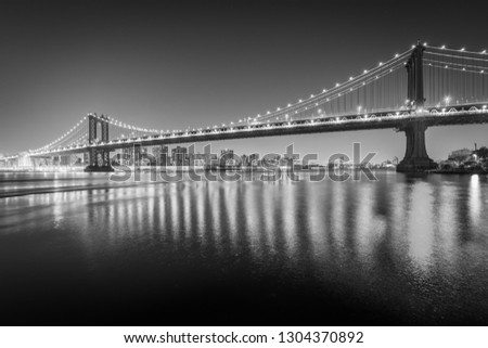 The Manhattan Bridge at night, seen from Brooklyn Bridge Park, in Brooklyn, New York.
