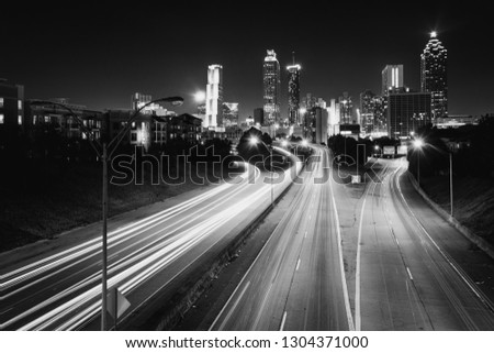 Traffic on Freedom Parkway and the Atlanta skyline at night, seen from the Jackson Street Bridge in Atlanta, Georgia.