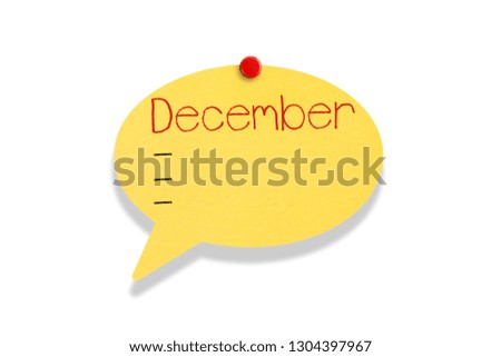 Sticky note pinned on white background, December