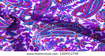 Background texture, pattern, paisley fabric cotton.  Designed by Kaffe Fassett for Free Spirit, the color palette of this large paisley is shades of green with hot pink, cobalt blue, 