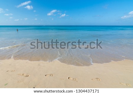 Beautiful wave on the beach, clear water, white sand in your holliday at andaman sea Phuket Thailand.