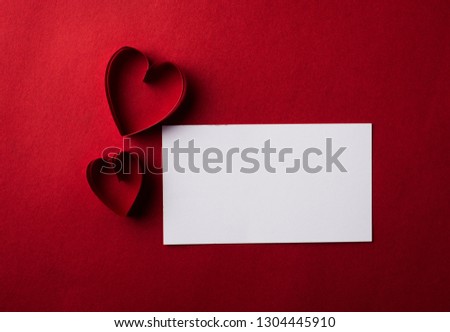 Red Heart paper and blank with note card on Red background