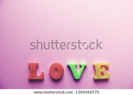 'love' word Close-up shot with a selective focus of the colorful magnetic letters for Valentine's Day