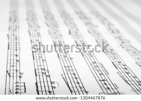 Sheet with music notes as background, closeup