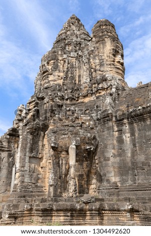 carved faces on South Gate of Angkor Thom, Siem Reap, Cambodia, Asia
