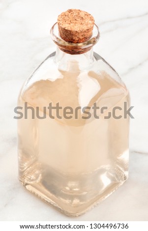 A photo of a corked bottle of a homemade face tonic