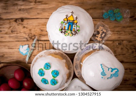 Easter cake with icing and decor on a wooden background