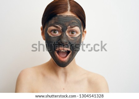 surprised woman in cosmetic mask portrait