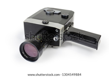 Super 8mm format amateur film movie camera powered by geared clockwork motor on a white background 

