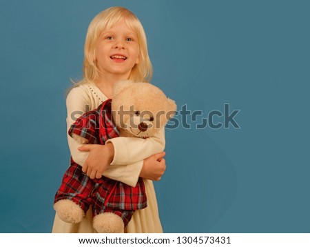 Playing with her toy friend. Small kid happy smiling. Little girl with teddy bear. Small girl hold toy bear. Little child with soft toy. Happy childhood. My favorite childhood toy, copy space.
